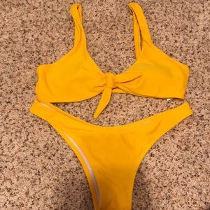 a yellow two piece bathing suit